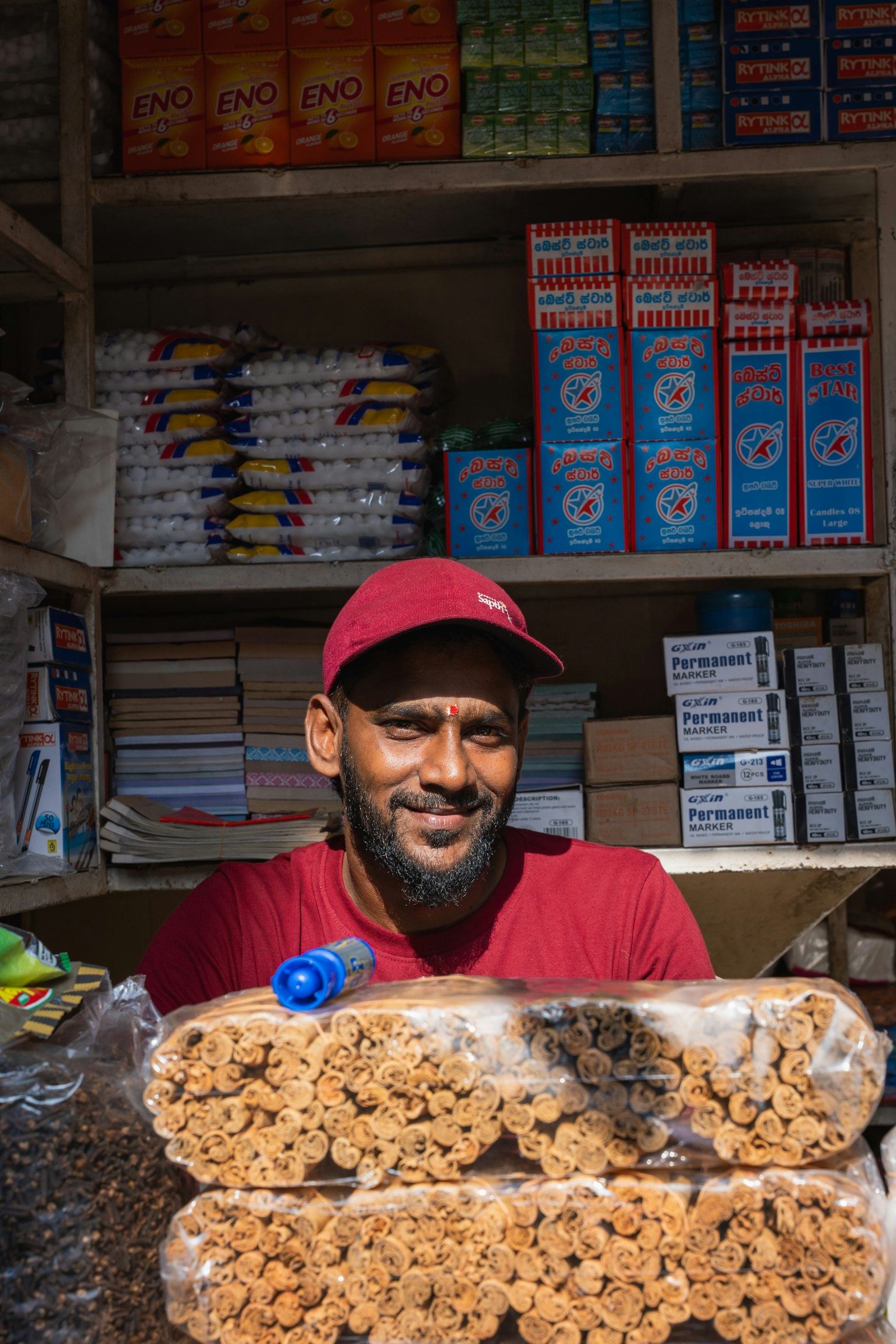 A shop owner at their counter.